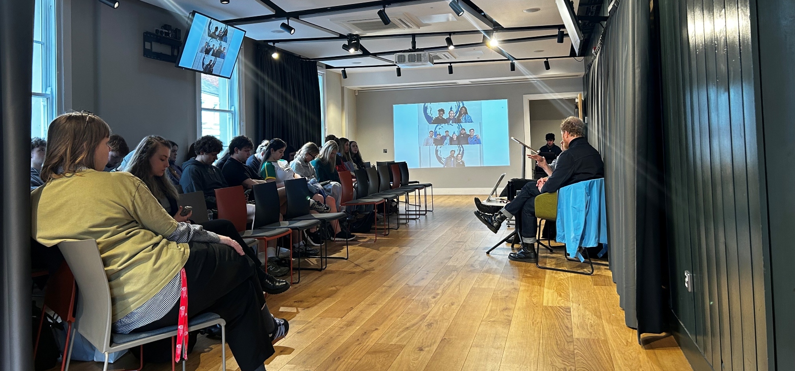 students and staff engaging in lecture